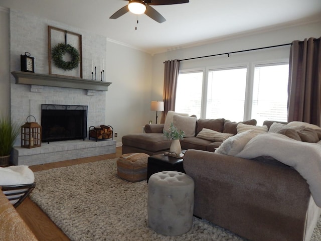 39W935 Berkshire Ct, Geneva, IL 60134 - living area with crown molding, a brick fireplace, wood finished floors, baseboards, and a ceiling fan