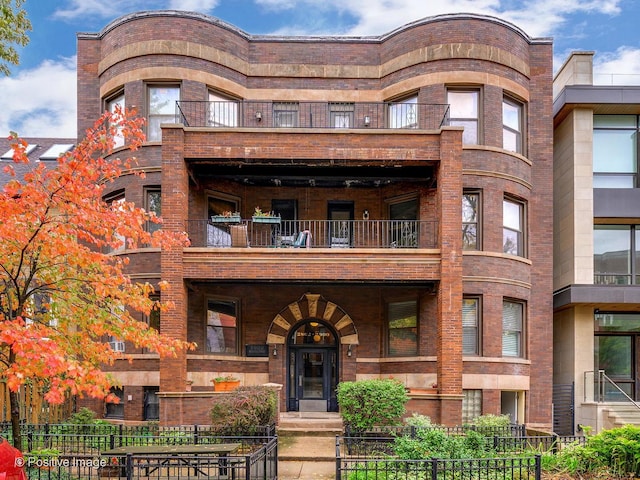 view of building exterior featuring a fenced front yard