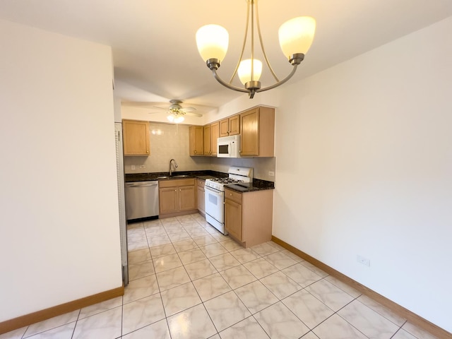 10310 Ridgeland Ave Unit 307, Chicago Ridge, IL 60415 - kitchen with baseboards, white appliances, a sink, ceiling fan with notable chandelier, and dark countertops