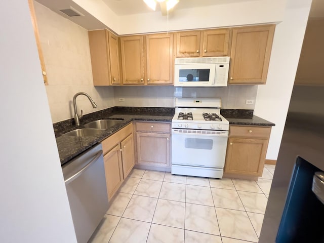 10310 Ridgeland Ave Unit 307, Chicago Ridge, IL 60415 - kitchen with a sink, white appliances, dark stone countertops, decorative backsplash, and light tile patterned floors