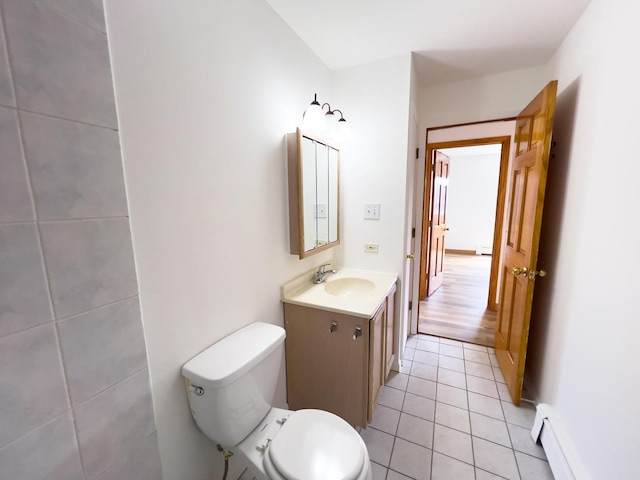 10310 Ridgeland Ave Unit 307, Chicago Ridge, IL 60415 - bathroom featuring vanity, toilet, a baseboard heating unit, and tile patterned floors