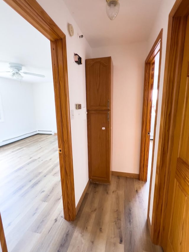 10310 Ridgeland Ave Unit 307, Chicago Ridge, IL 60415 - corridor featuring light wood-style floors, baseboards, and baseboard heating