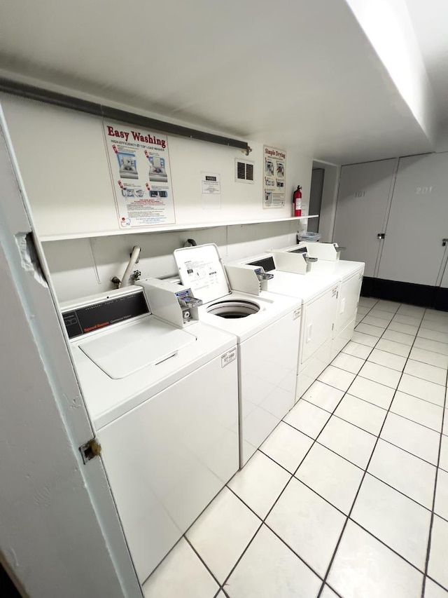 10310 Ridgeland Ave Unit 307, Chicago Ridge, IL 60415 - community laundry room with separate washer and dryer, light tile patterned floors, and visible vents