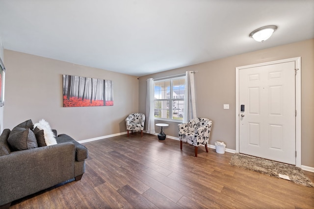 interior space with baseboards and wood finished floors