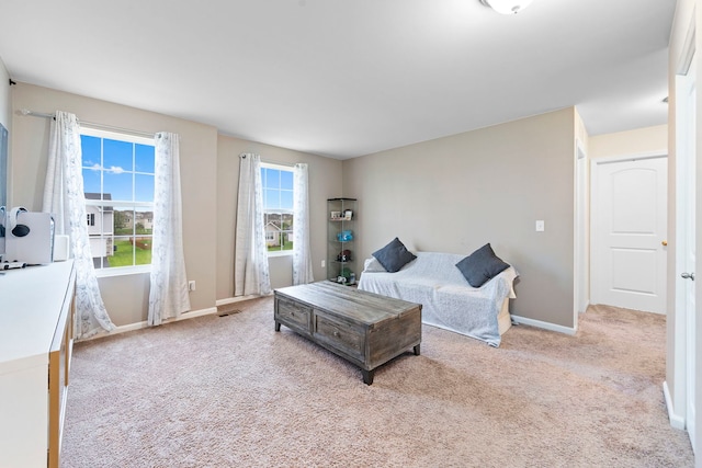 bedroom featuring baseboards, carpet flooring, and visible vents