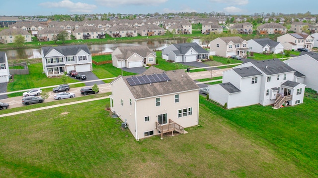 aerial view featuring a residential view and a water view