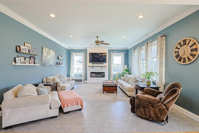 tiled living area with recessed lighting, crown molding, baseboards, a large fireplace, and a ceiling fan