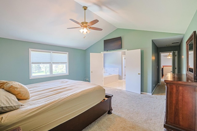 carpeted bedroom with lofted ceiling, ensuite bath, a ceiling fan, and baseboards