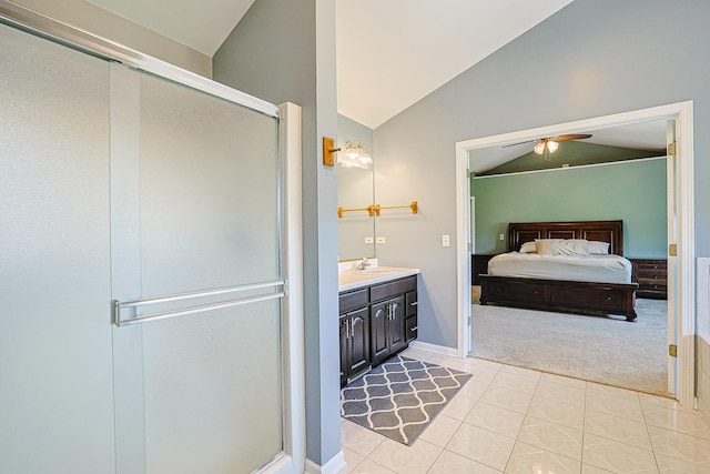 bathroom with lofted ceiling, ensuite bath, a shower stall, and vanity