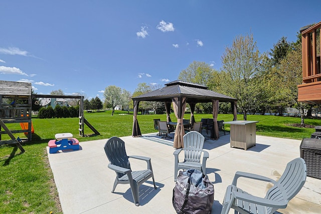 view of patio with a playground and a gazebo
