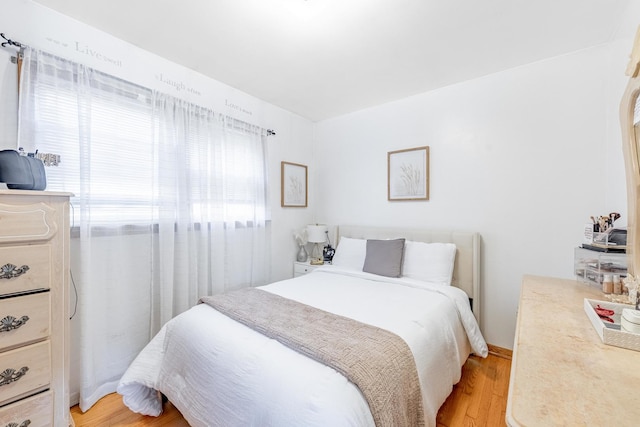 bedroom with light wood-style floors