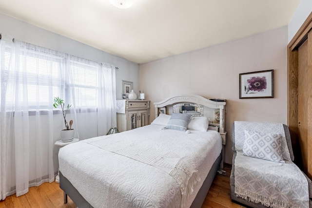 bedroom with wood finished floors