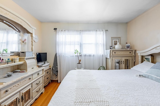 bedroom with light wood-type flooring
