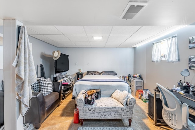 bedroom with visible vents and a paneled ceiling