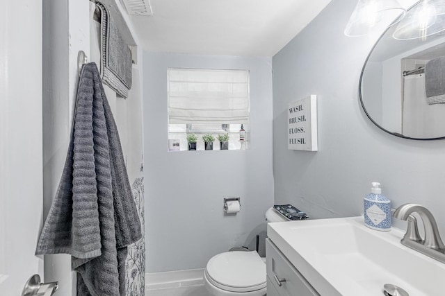 full bath featuring visible vents, toilet, and vanity