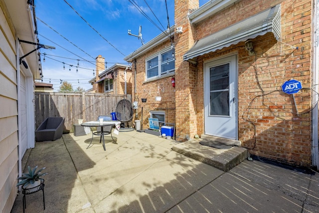 view of patio featuring fence