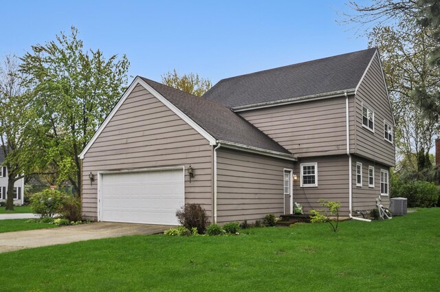 23 Westmoreland Ln, Naperville, IL 60540 - view of property exterior with a shingled roof, a garage, central AC unit, concrete driveway, and a lawn