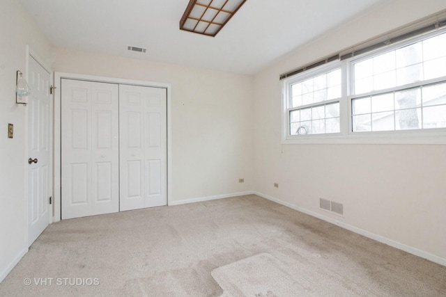 23 Westmoreland Ln, Naperville, IL 60540 - unfurnished bedroom featuring carpet floors, baseboards, a closet, and visible vents