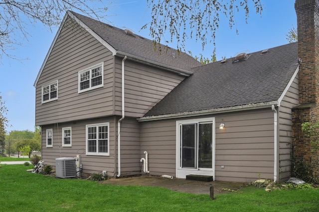23 Westmoreland Ln, Naperville, IL 60540 - rear view of property featuring a lawn, a chimney, and central AC