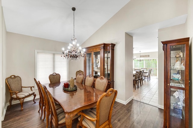 13083 Timber Ct, Palos Heights, IL 60463 - dining area featuring an inviting chandelier, baseboards, lofted ceiling, and dark wood-style floors