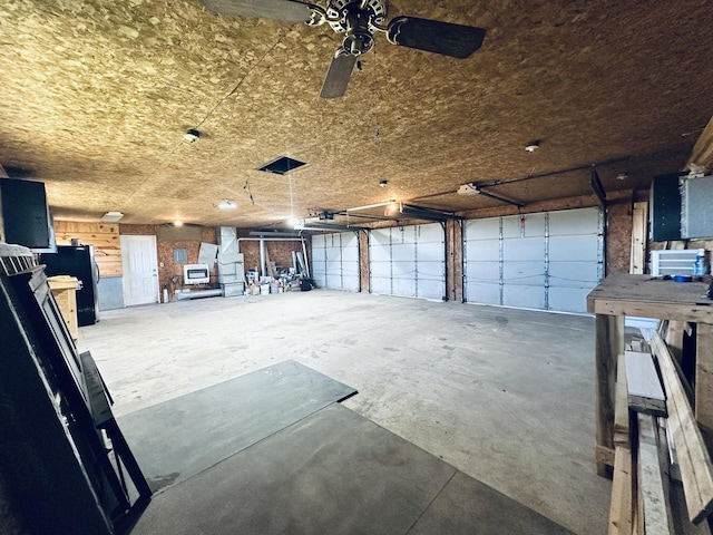 23678 N 2700 E Rd, Odell, IL 60460 - garage with ceiling fan and freestanding refrigerator