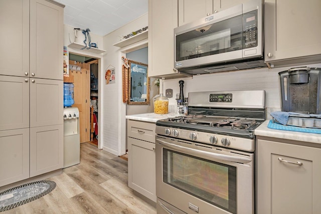 5203 W Court St, Monee, IL 60449 - kitchen with stainless steel appliances, light wood finished floors, and light countertops