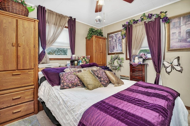 5203 W Court St, Monee, IL 60449 - carpeted bedroom with multiple windows, crown molding, baseboard heating, and a ceiling fan