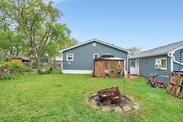 5203 W Court St, Monee, IL 60449 - rear view of property with an outdoor fire pit and a gazebo
