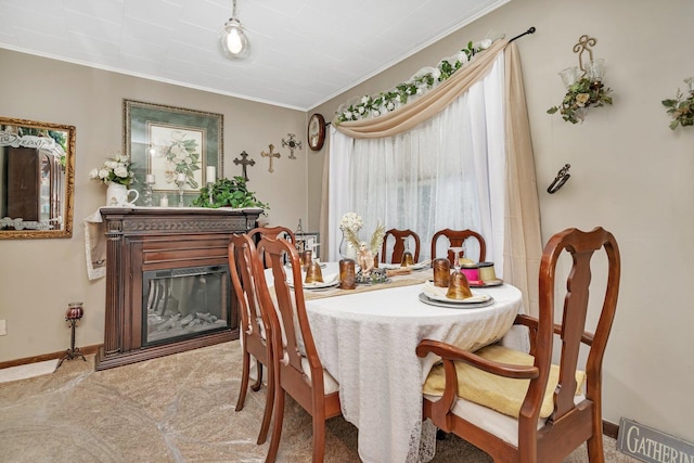 5203 W Court St, Monee, IL 60449 - carpeted dining area with crown molding, baseboards, and a glass covered fireplace