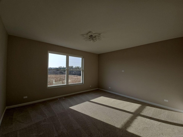 1221 Honey Lake Rd, Lake Zurich, IL 60047 - spare room featuring baseboards, dark colored carpet, and visible vents