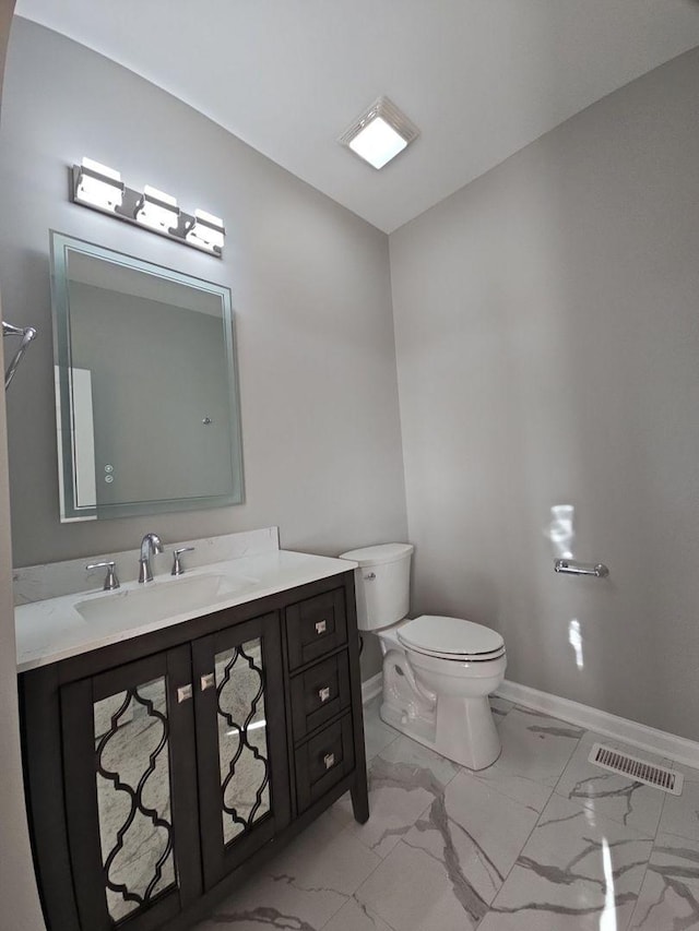 1221 Honey Lake Rd, Lake Zurich, IL 60047 - half bathroom featuring vanity, toilet, marble finish floor, baseboards, and visible vents