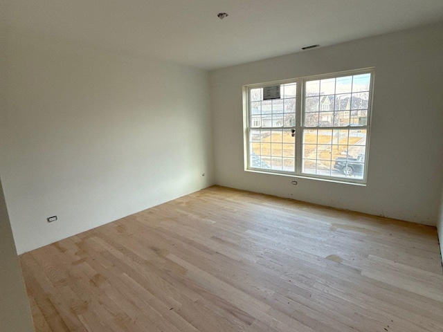 1221 Honey Lake Rd, Lake Zurich, IL 60047 - empty room with light wood-type flooring, a wealth of natural light, and visible vents