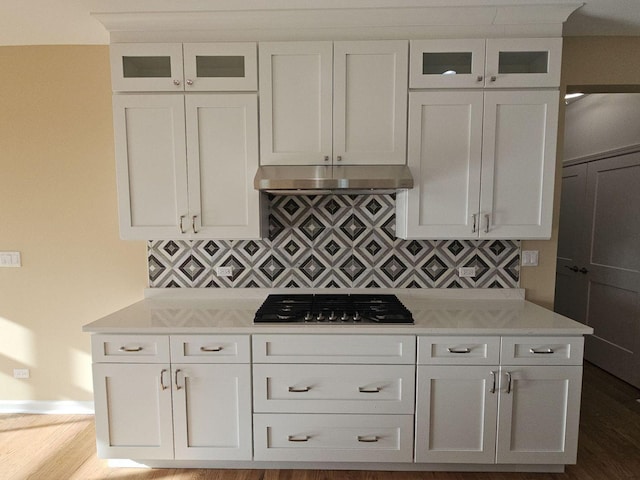 1221 Honey Lake Rd, Lake Zurich, IL 60047 - kitchen with glass insert cabinets, backsplash, dark wood-style flooring, white cabinets, and stainless steel gas stovetop