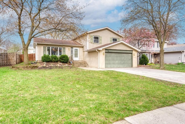 split level home featuring a front lawn, fence, and driveway
