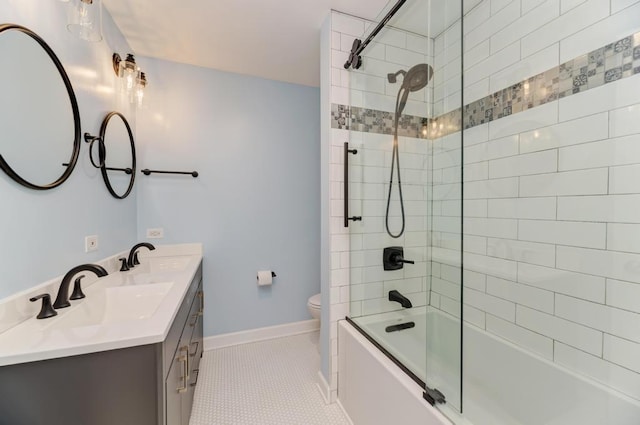 full bathroom featuring a sink, tile patterned flooring, toilet, and shower / washtub combination
