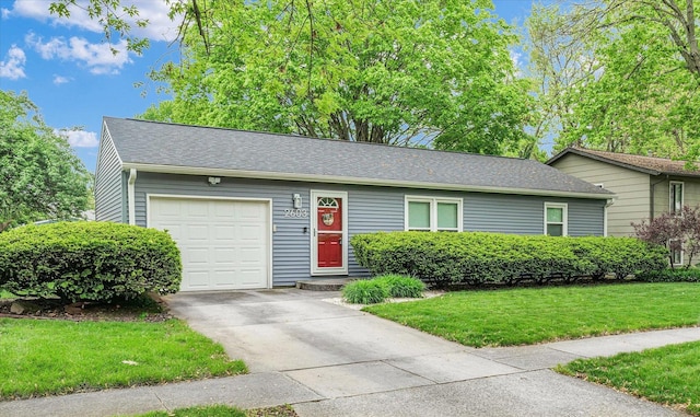 2603 Trafalgar Sq, Champaign, IL 61821 - view of front of property with a garage, driveway, a front yard, and roof with shingles