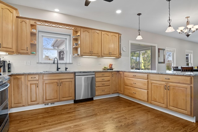 kitchen featuring stainless steel dishwasher, open shelves, wood finished floors, a sink, and light stone counters