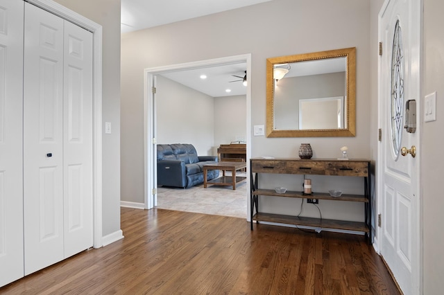 foyer featuring a ceiling fan, baseboards, recessed lighting, and wood finished floors
