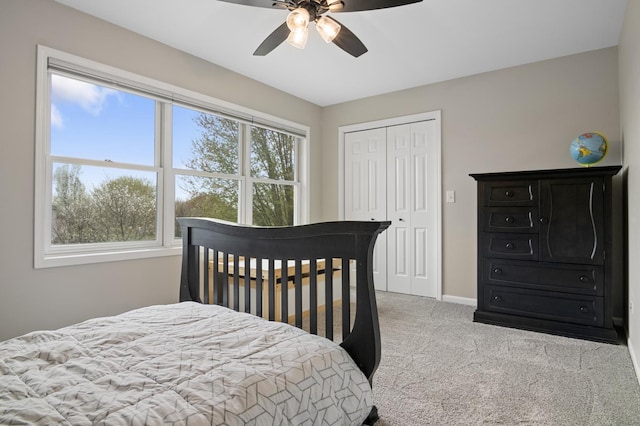 bedroom featuring a closet, carpet, ceiling fan, and baseboards