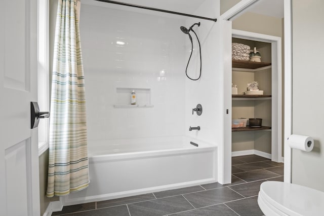 bathroom with tile patterned flooring, shower / bathtub combination with curtain, and toilet