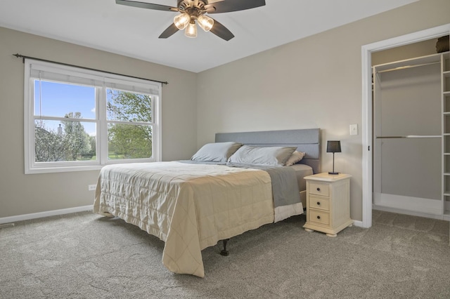 carpeted bedroom with baseboards and ceiling fan