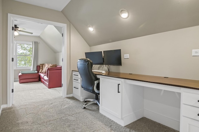 office space with ceiling fan, light carpet, and lofted ceiling