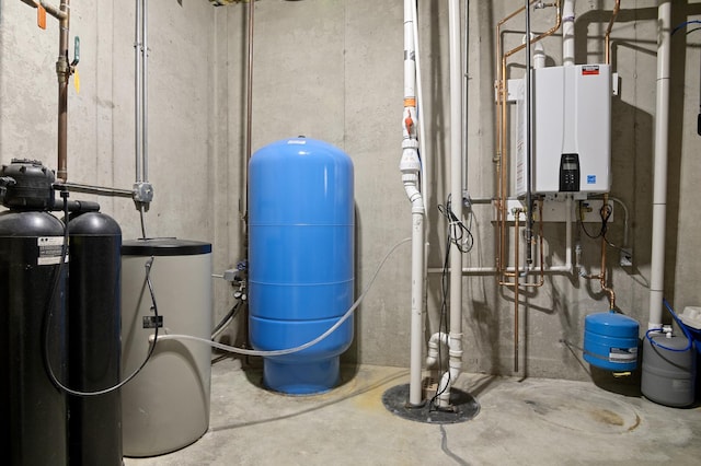 utility room featuring water heater