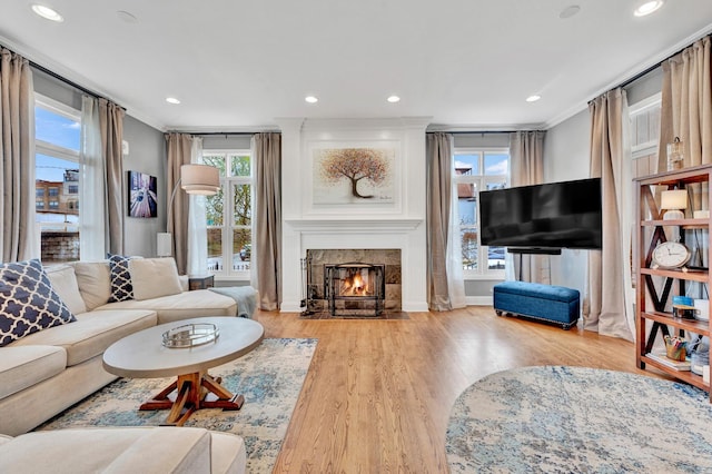 1800 W Melrose St, Chicago, IL 60657 - living room with crown molding, wood finished floors, a glass covered fireplace, and recessed lighting
