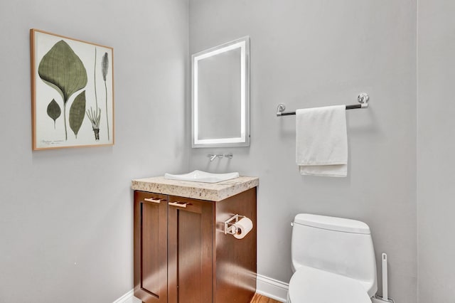 1800 W Melrose St, Chicago, IL 60657 - bathroom featuring toilet, vanity, and baseboards
