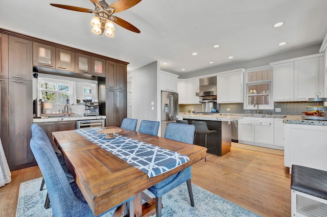 1800 W Melrose St, Chicago, IL 60657 - dining space featuring a ceiling fan, light wood-type flooring, recessed lighting, and wine cooler