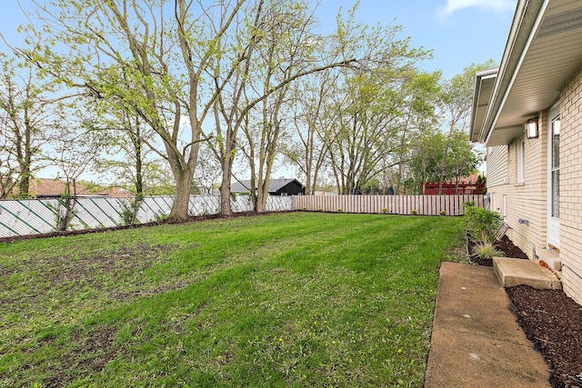 view of yard with a fenced backyard