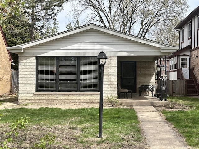 9911 Kedvale Ave, Skokie, IL 60076 - bungalow-style house featuring brick siding and covered porch