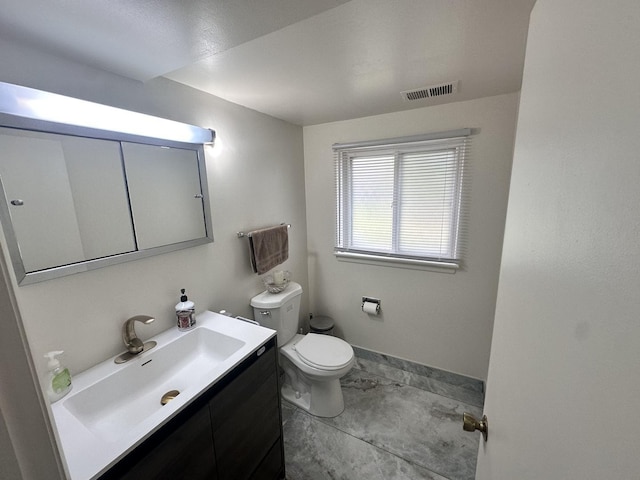 9911 Kedvale Ave, Skokie, IL 60076 - bathroom with vanity, toilet, and visible vents