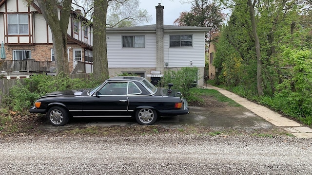 9911 Kedvale Ave, Skokie, IL 60076 - exterior space featuring brick siding and a chimney